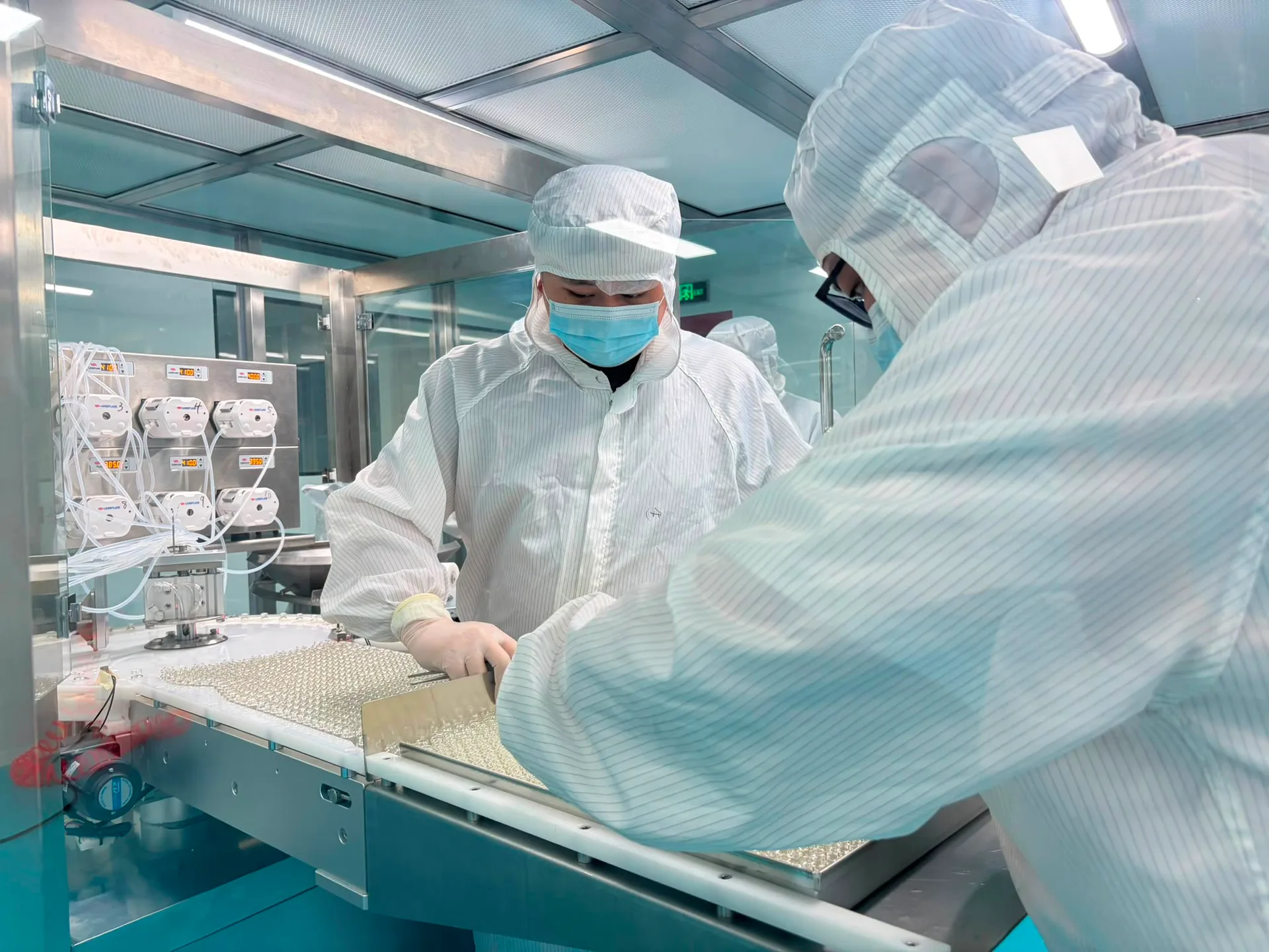 Peristaltic dosing & tray transfer